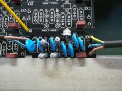 Cable soldering with through hole assembly for attaching wire to PCB